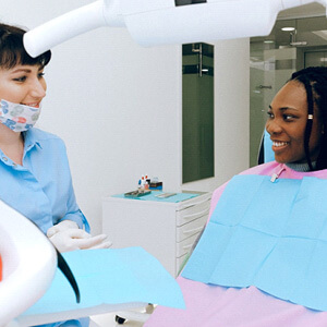 Dentist speaking with patient