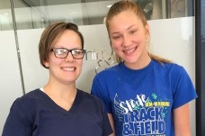 Dental team member with teen dentistry patient