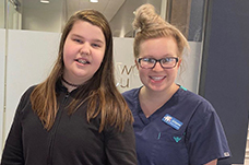 Teen dental patient and dentistry team member