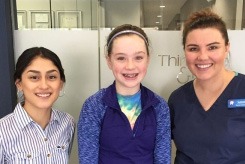 Team member with mother and daughter