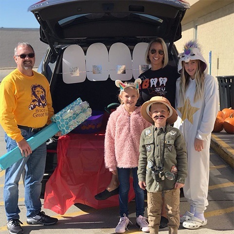 Dentist and kids at community event