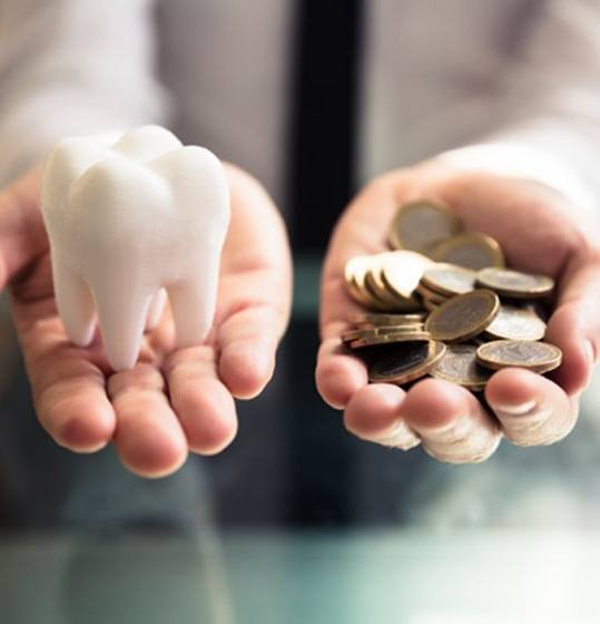 Balancing a tooth with a pile of coins