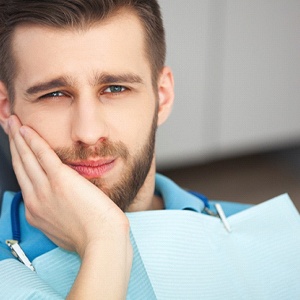 man holding his face showing that every emergency is different