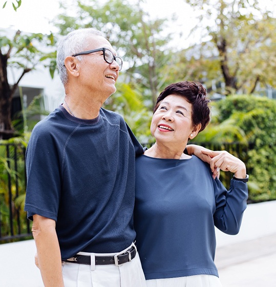 a happy couple taking a walk