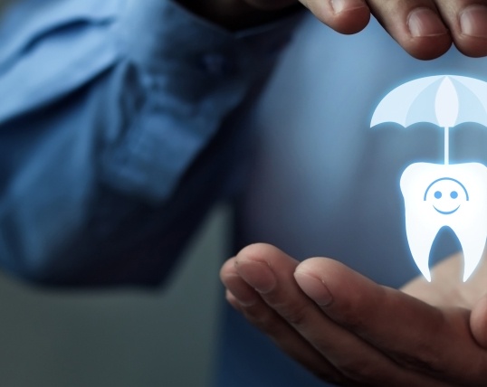 Hand holding an animated tooth under an umbrella