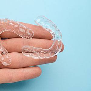 a closeup of Invisalign aligners in Denison