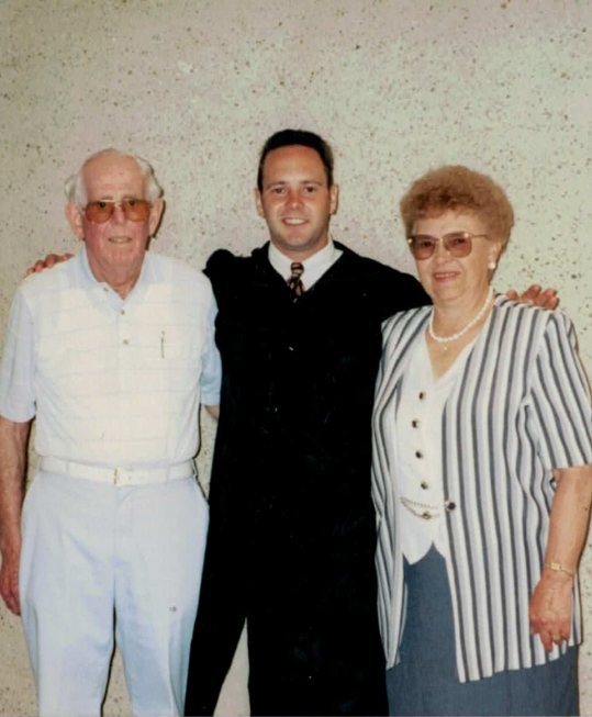 Dr. Bygness and his parents at dental office graduation