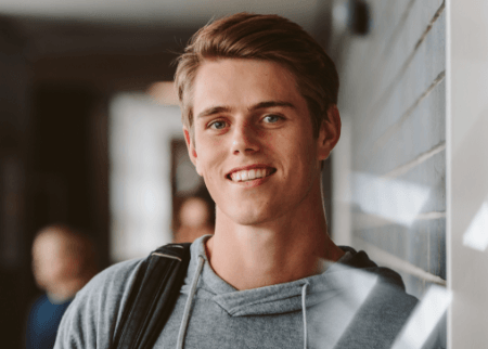 Young man smiling after orthodontic treatment