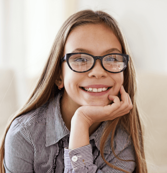 Preteen girl smiling after phase 1 orthodontics