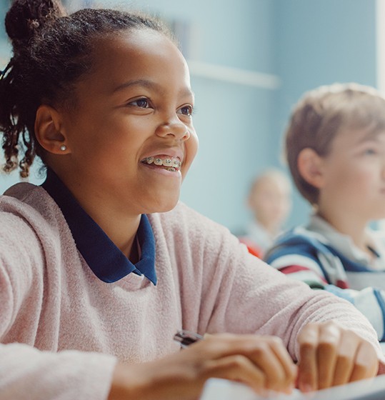 Girl with braces in a classroom