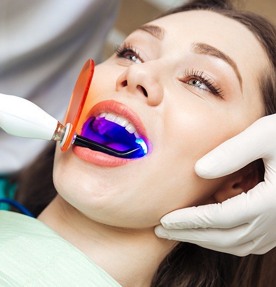 Woman receiving dental sealants