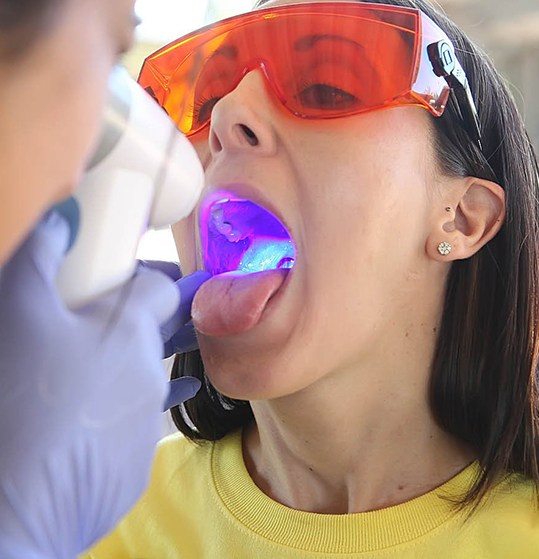 Patient receiving an oral cancer screening