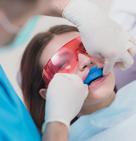 Young girl receiving fluoride treatment