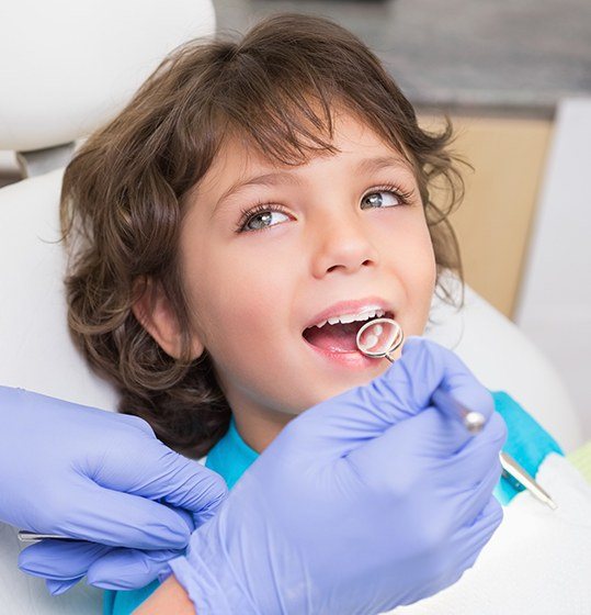 Young girl smiling during children's dentistry visit