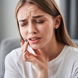 a patient suffering from tooth pain