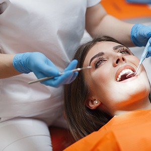a patient undergoing a dental exam in Denison