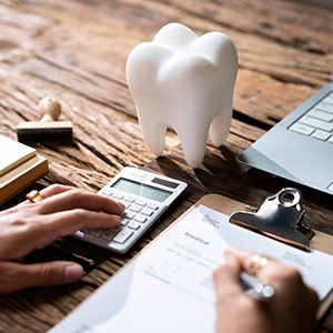 a patient filling out a dental insurance form