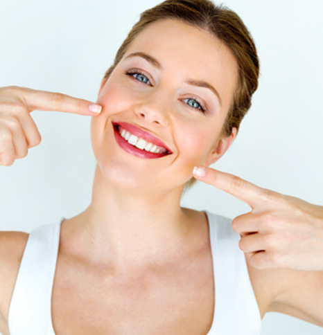 Woman smiling after teeth whitening in Denison