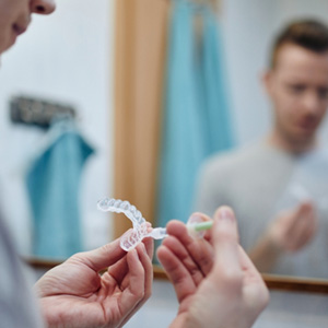 Patient using professional take-home whitening kit