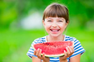 girl with braces and watermelon