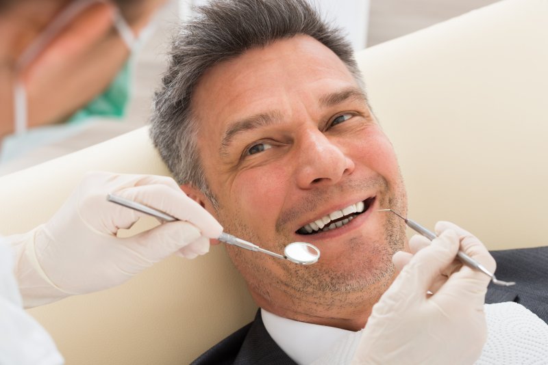 Man smiling at dentist